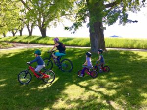 Mommy bloggers and their kids learn how to mountain bike.
